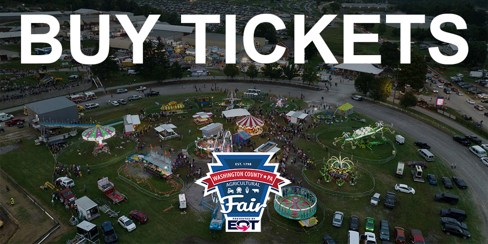 Drone shot of fair that says "buy tickets"